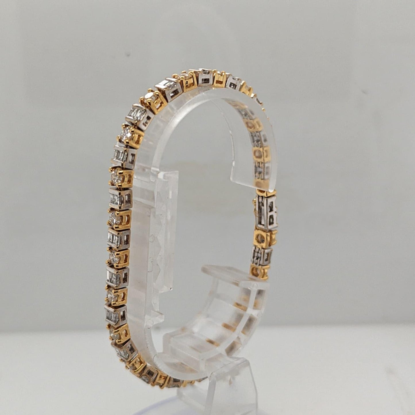 DIAMOND TENNIS BRACELET BAGUETTE AND ROUND 7.12CTW TWO TONE GOLD