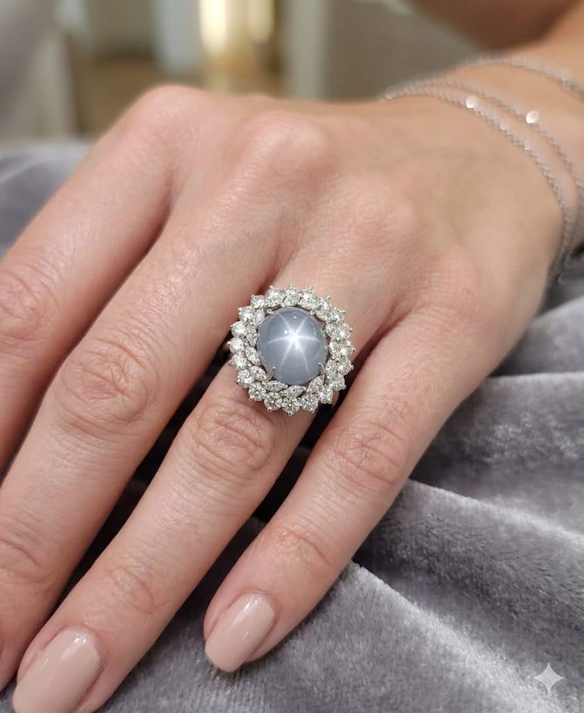CABOCHON STAR SAPPHIRE AND DIAMOND CLUSTER RING PLATINUM