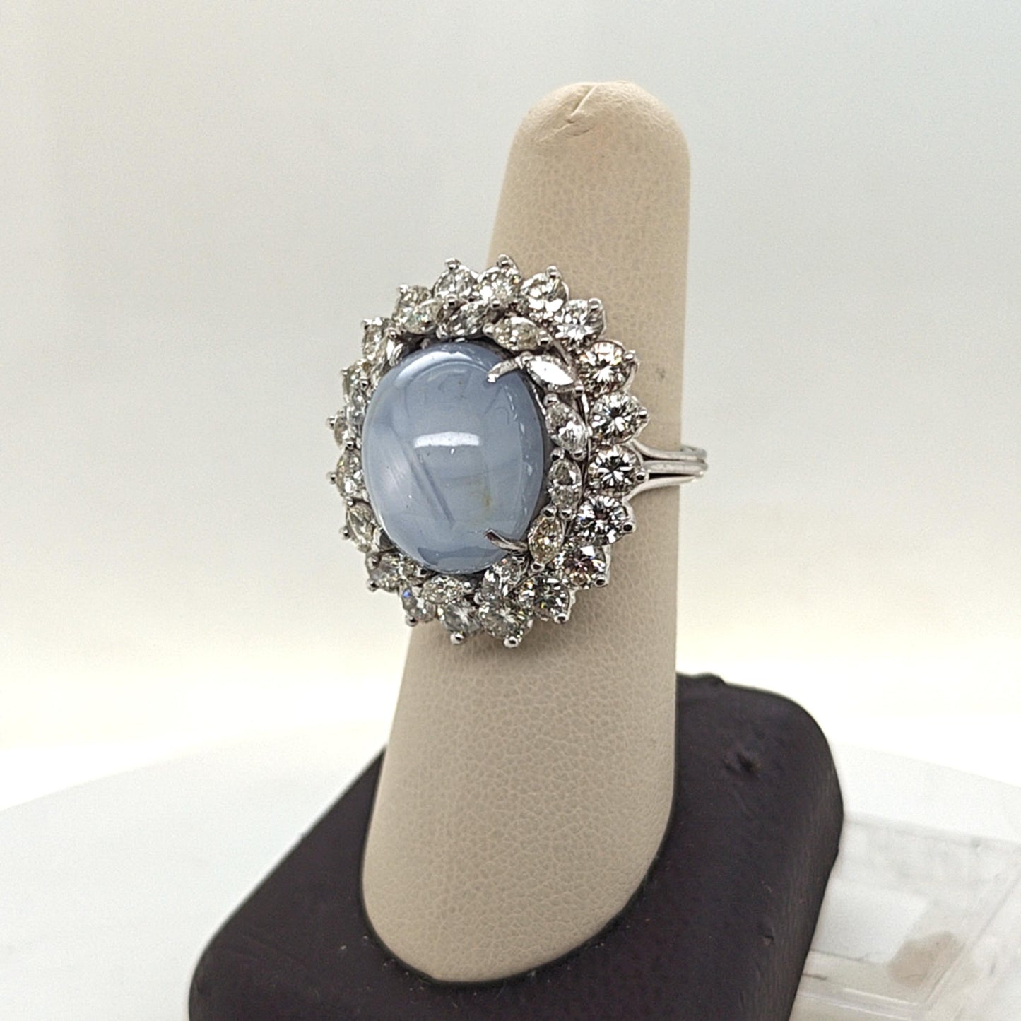 CABOCHON STAR SAPPHIRE AND DIAMOND CLUSTER RING PLATINUM