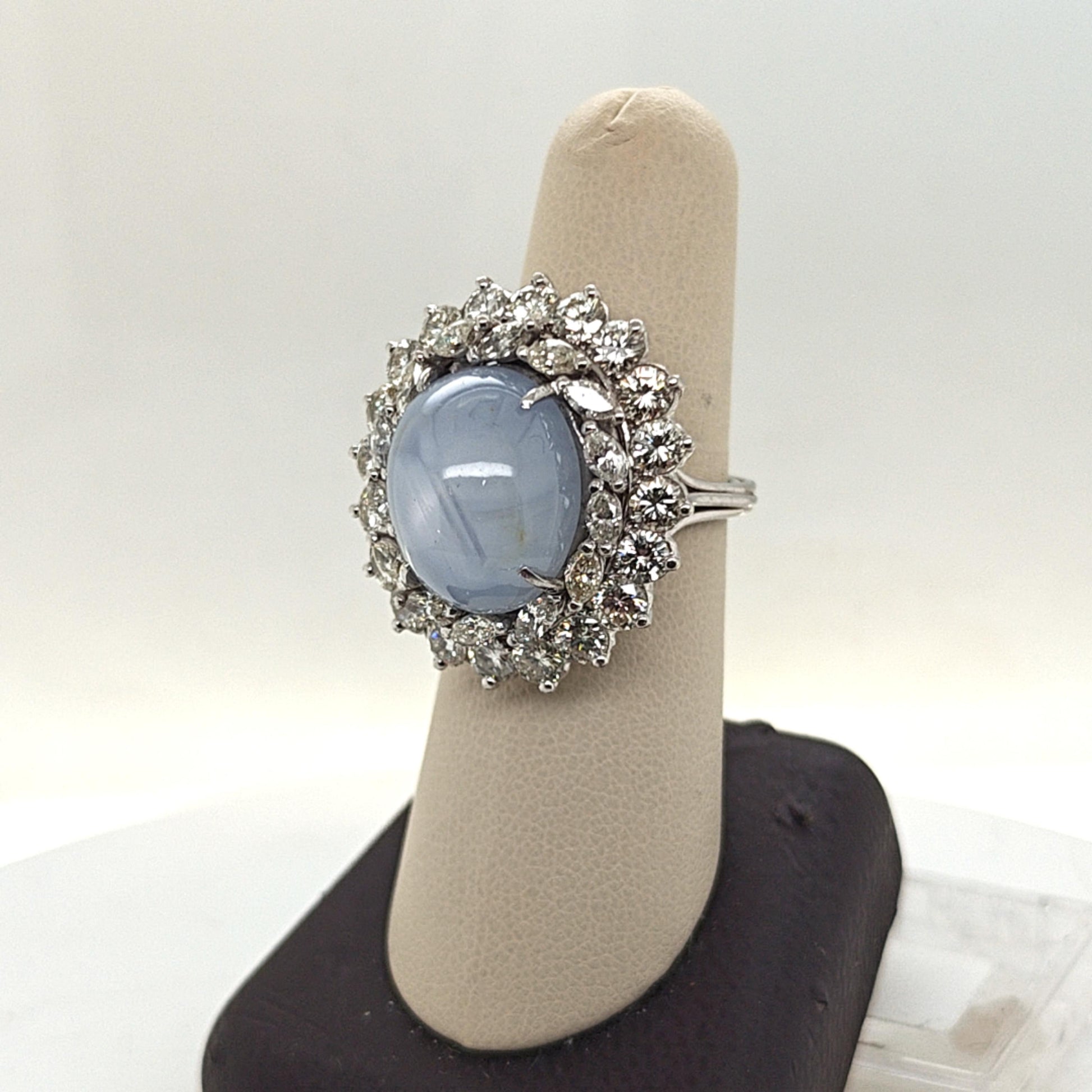 CABOCHON STAR SAPPHIRE AND DIAMOND CLUSTER RING PLATINUM