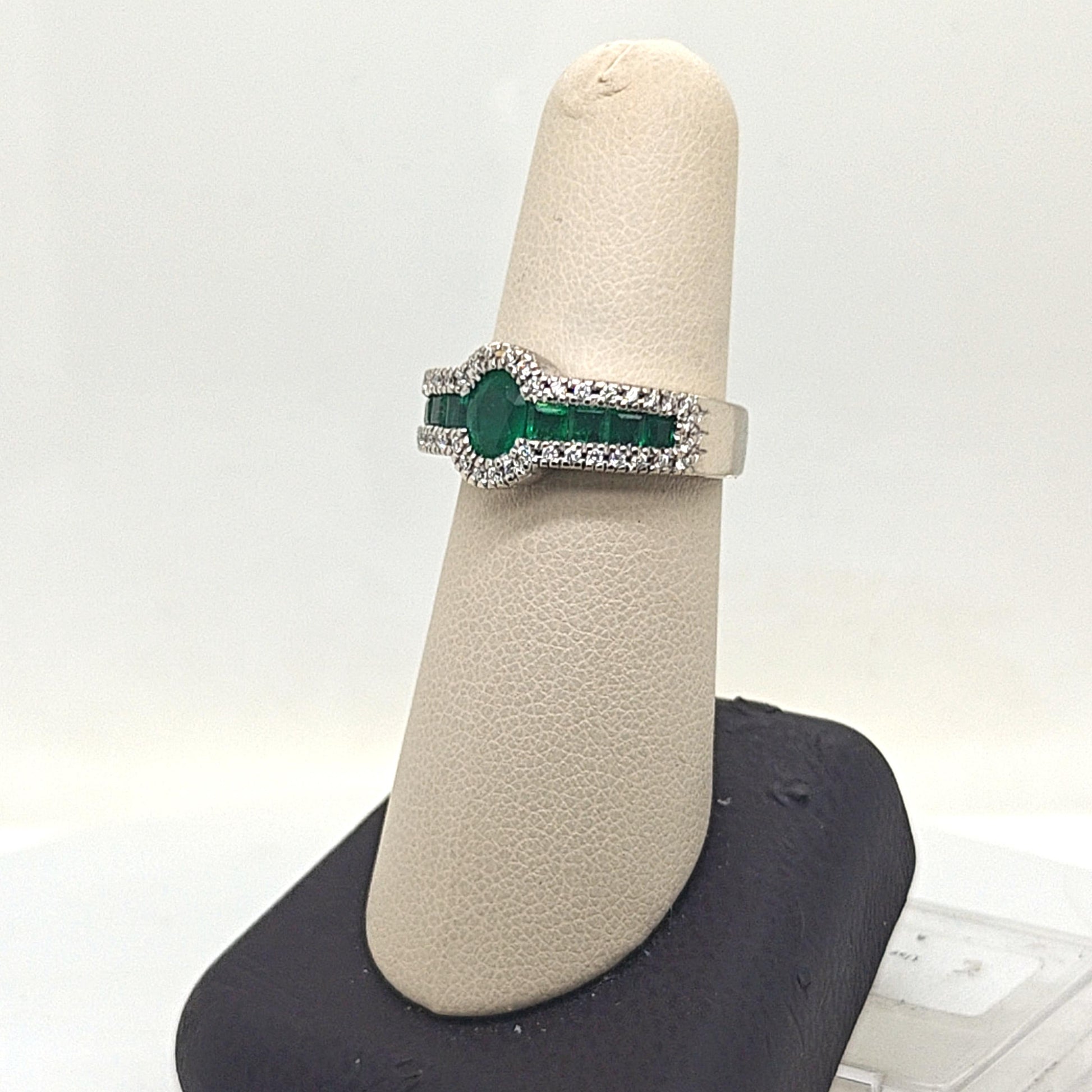OVAL EMERALD AND DIAMOND HALO RING WHITE GOLD