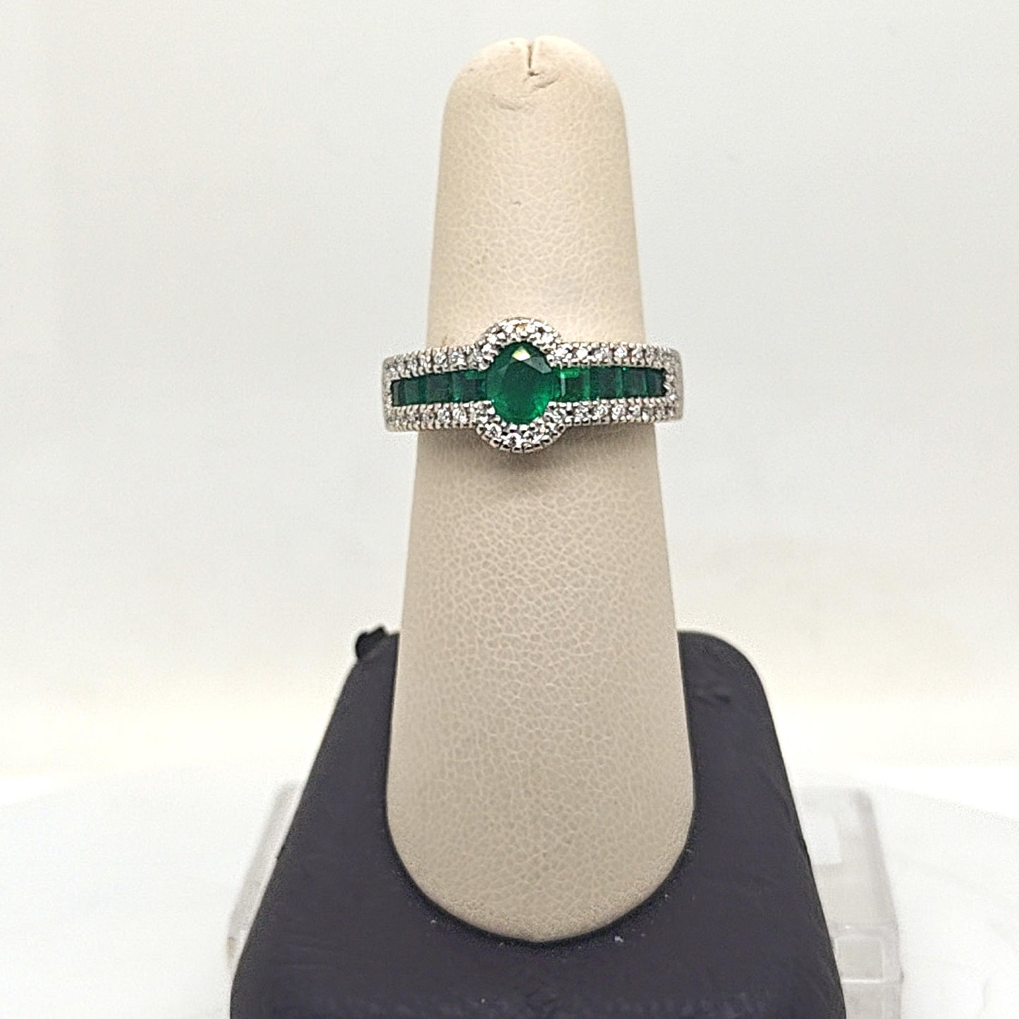 OVAL EMERALD AND DIAMOND HALO RING WHITE GOLD
