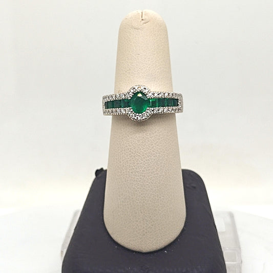 OVAL EMERALD AND DIAMOND HALO RING WHITE GOLD