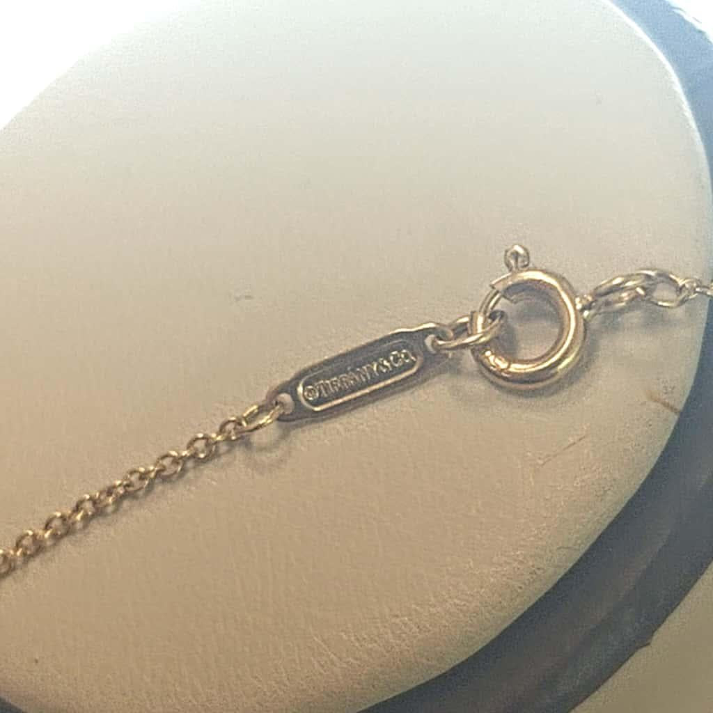 TIFFANY NECKLACE WITH PEACE SIGN YELLOW GOLD