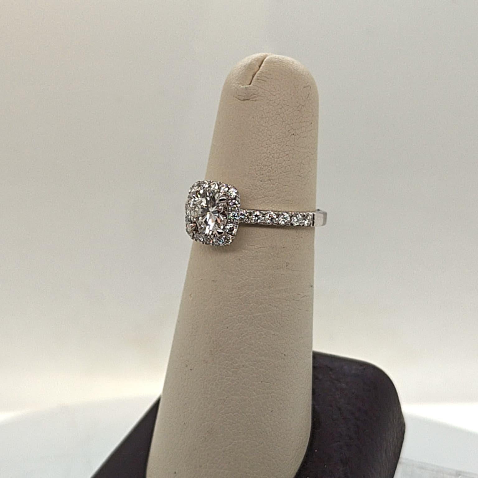 DIAMOND ENGAGEMENT RING  0.79CT WITH A HALO F VVS (GIA) PLATINUM