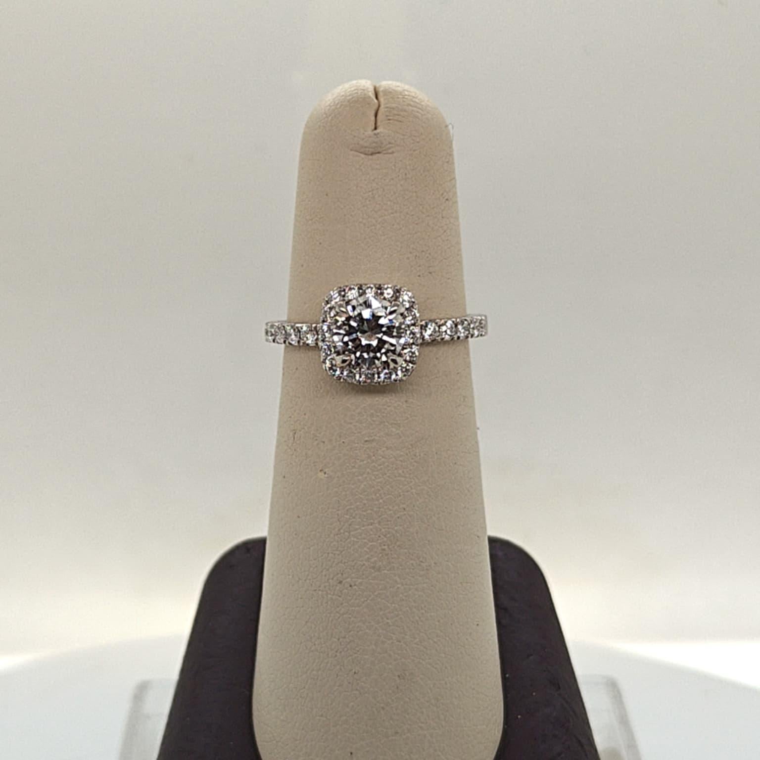 DIAMOND ENGAGEMENT RING  0.79CT WITH A HALO F VVS (GIA) PLATINUM